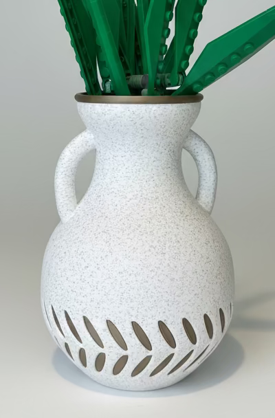 White textured vase with green plants 