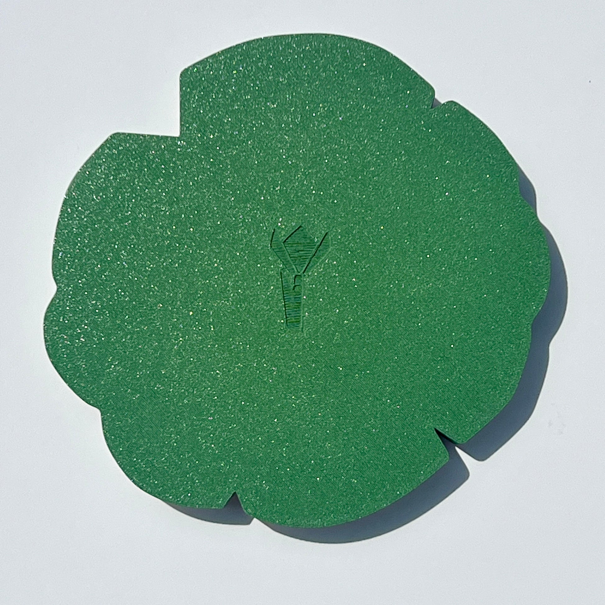 Underside of the matcha green lily pad-shaped trinket tray.
