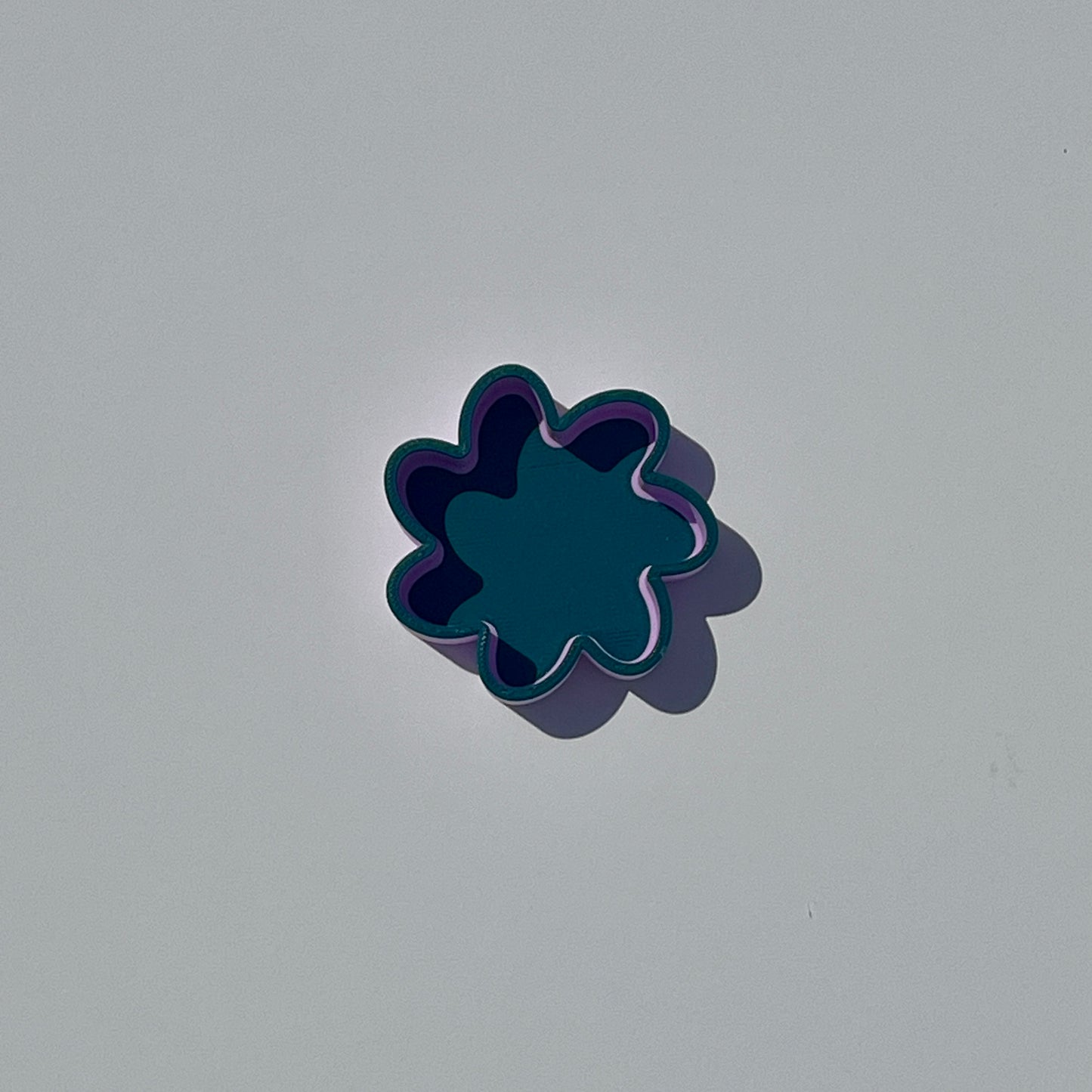 Small flower-shaped trinket dish in Morandi green and purple.