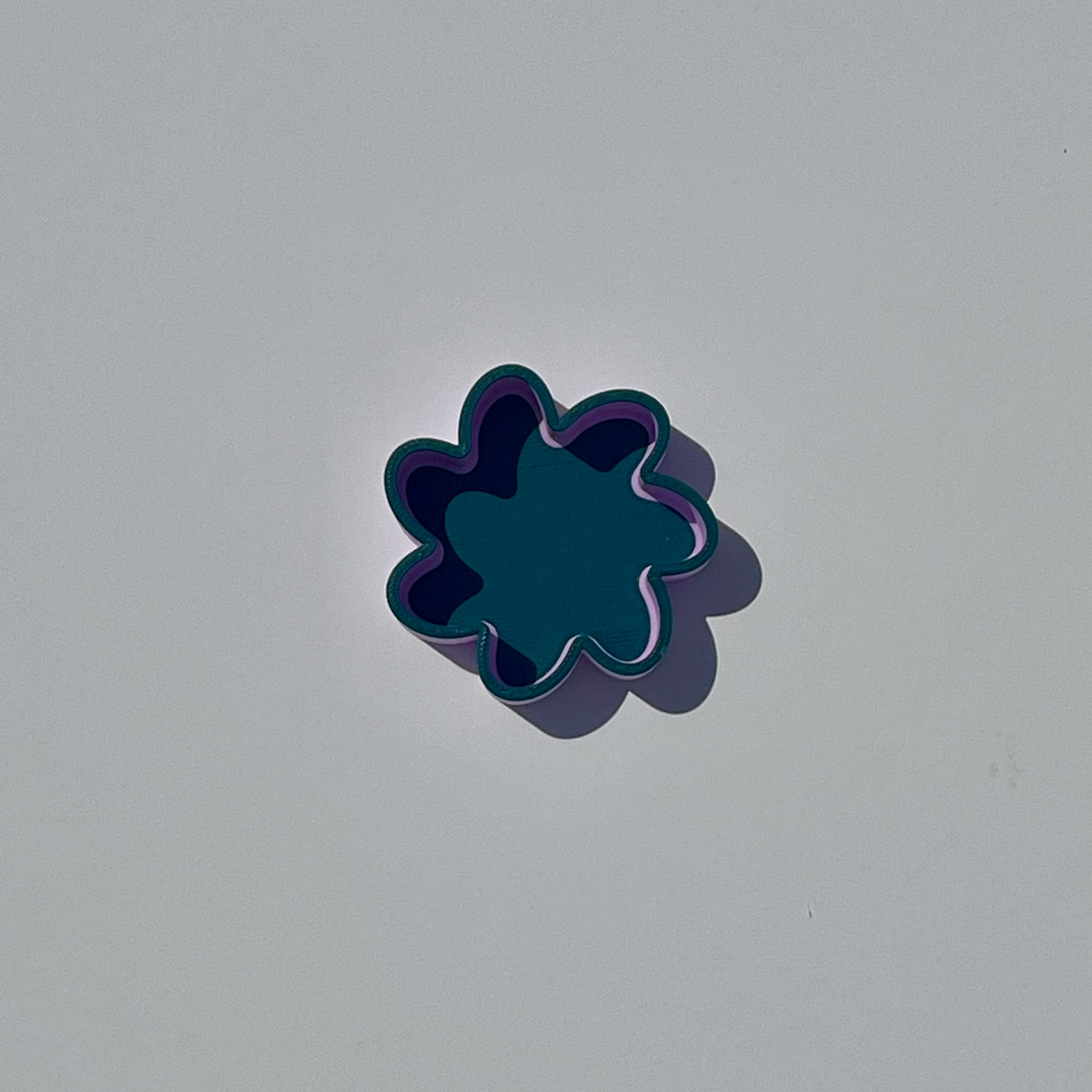 Small flower-shaped trinket dish in Morandi green and purple.