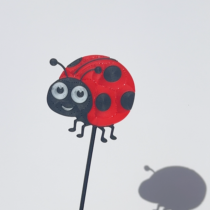 Red and black translucent PLA ladybird decorative stem with a stained-glass-inspired design.