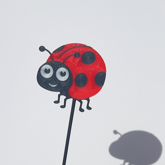 Red and black translucent PLA ladybird decorative stem with a stained-glass-inspired design.