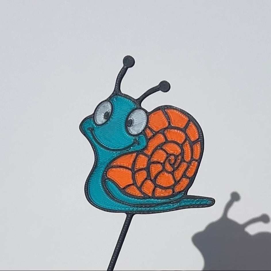 Turquoise and orange translucent PLA snail decorative stem with a stained-glass-inspired design.
