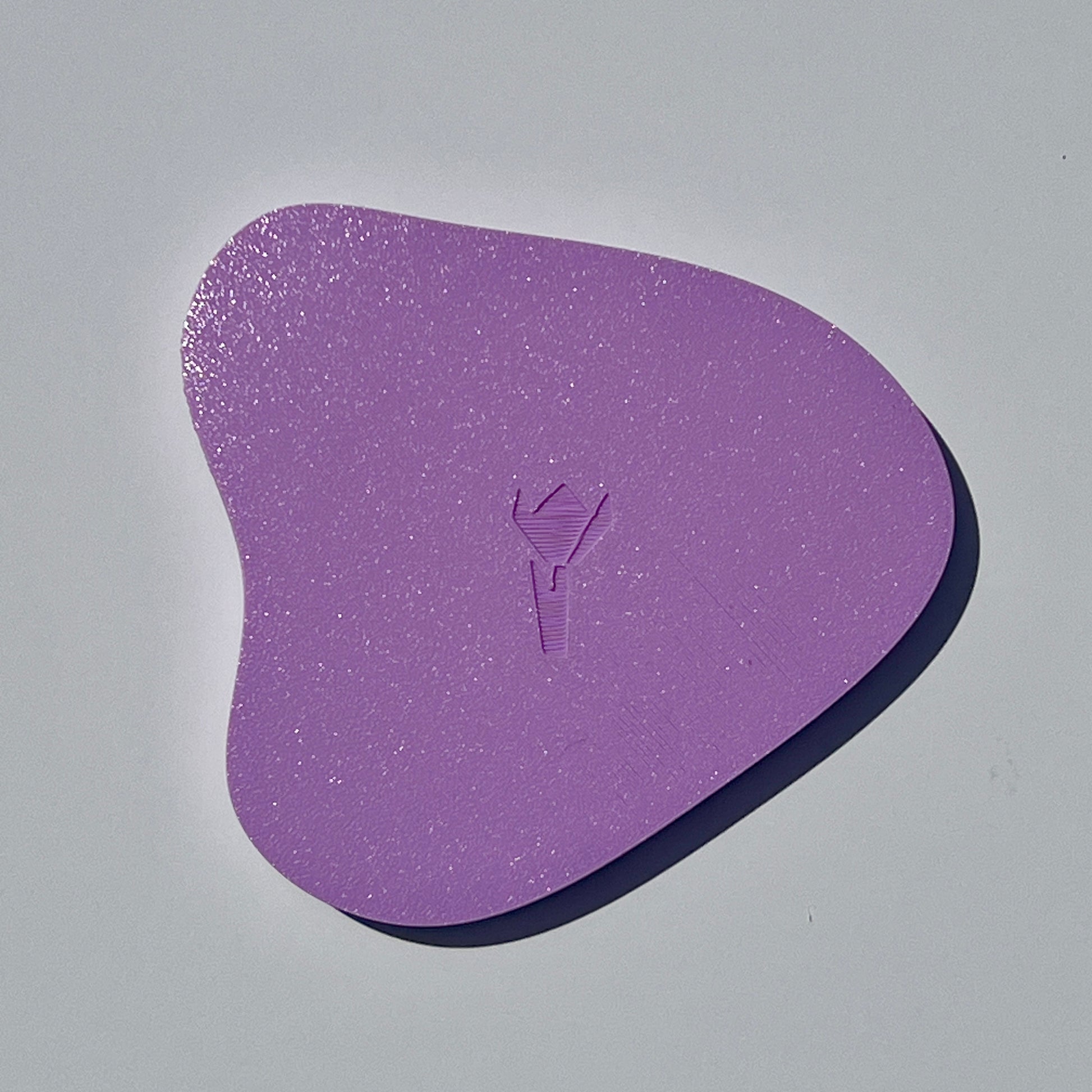 Underside of the lilac organic-shaped 3D printed trinket tray.