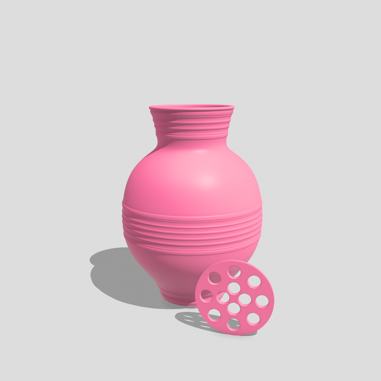 Small decorative flower vase in Barbie pink with removable stem holder