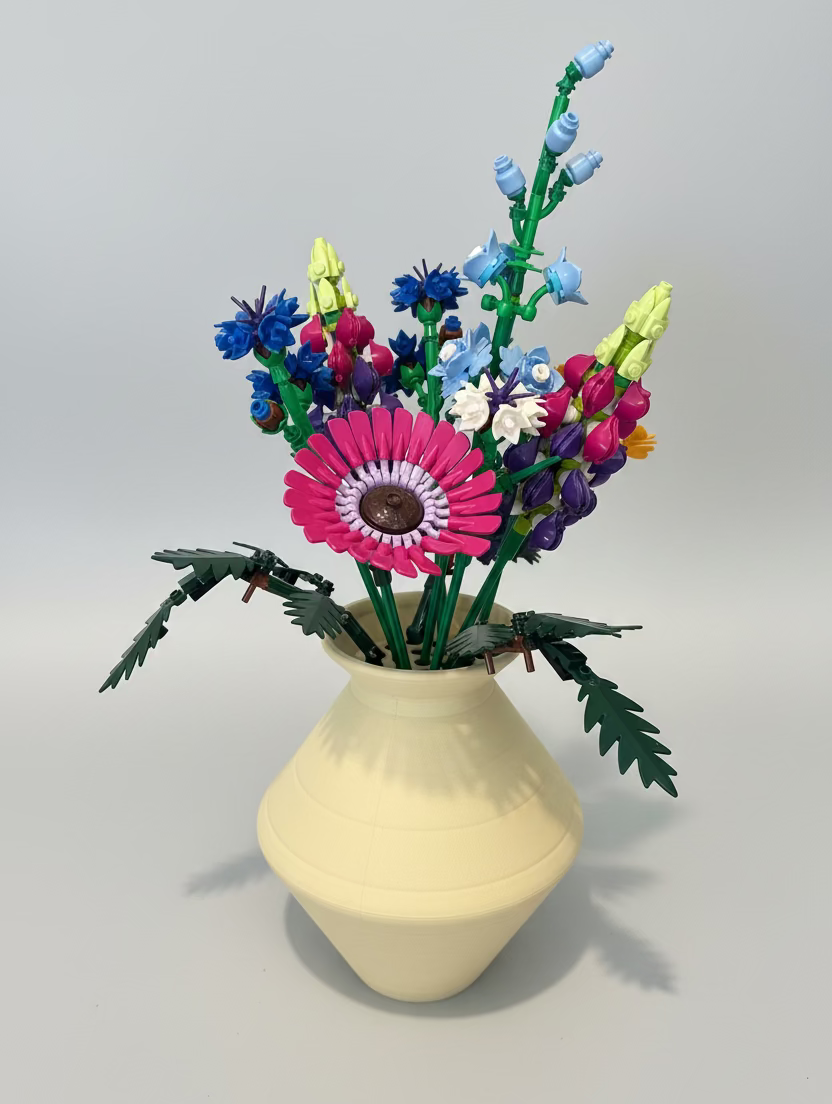 Vase with colorful artificial flowers 