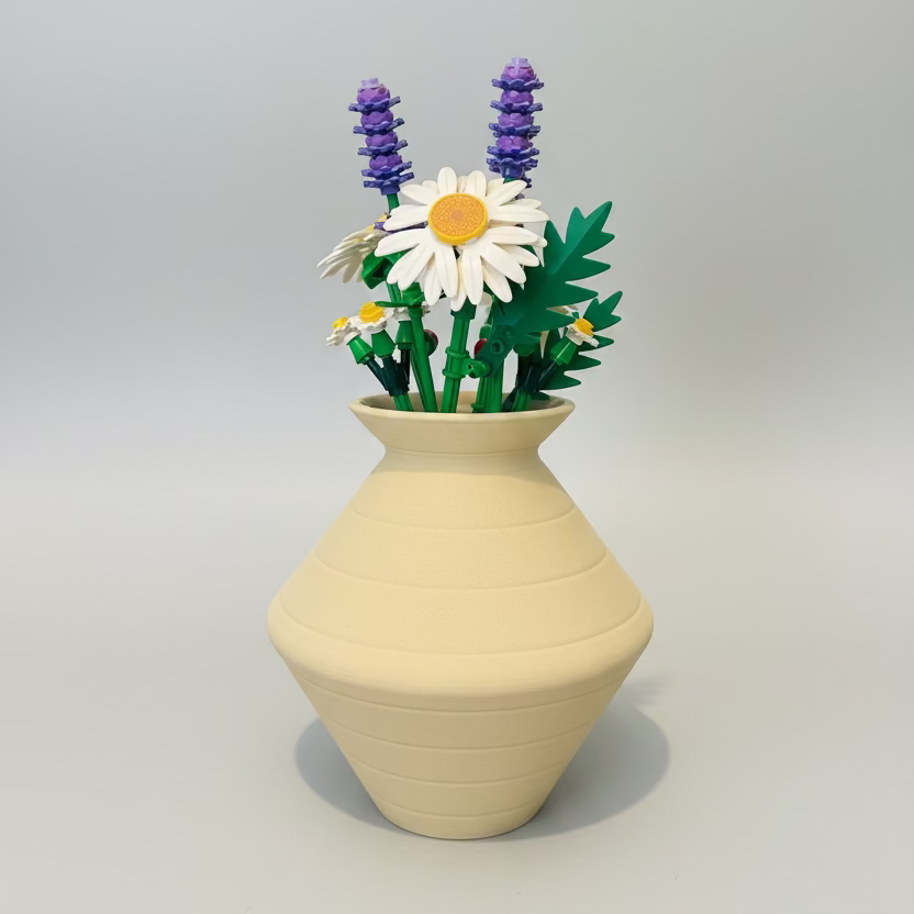 Beige vase with artificial flowers