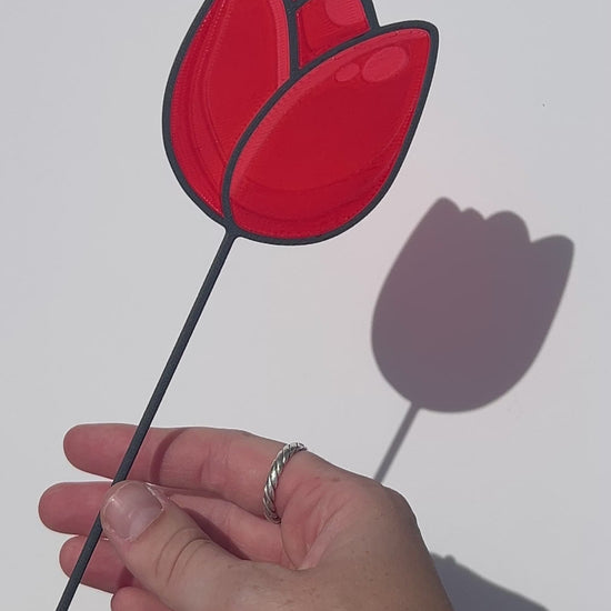 Red translucent PLA tulip decorative stem with a black stained-glass-inspired outline.