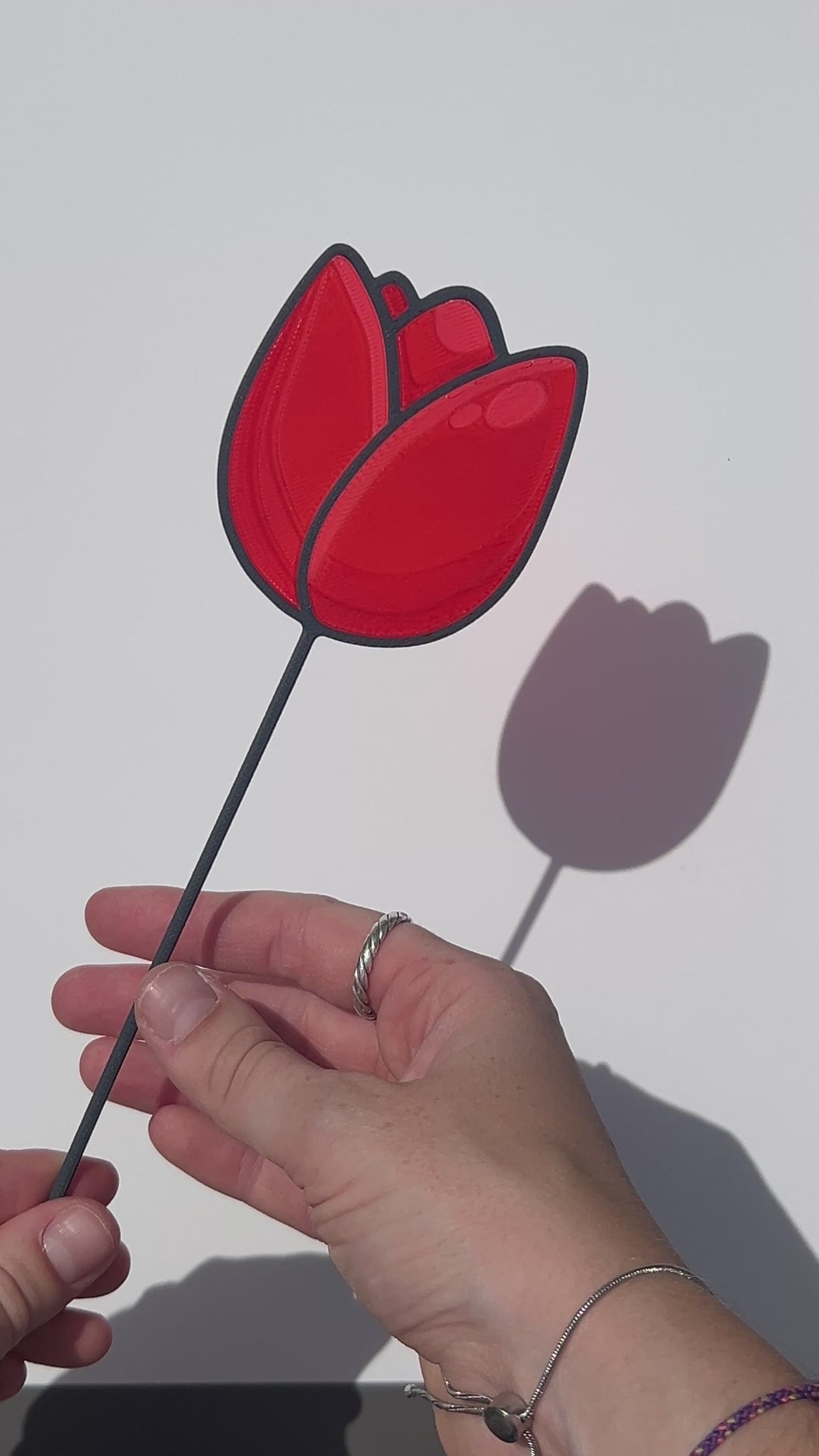 Red translucent PLA tulip decorative stem with a black stained-glass-inspired outline.