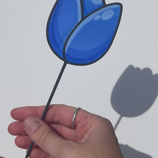 Blue translucent PLA tulip decorative stem with a black stained-glass-inspired outline.