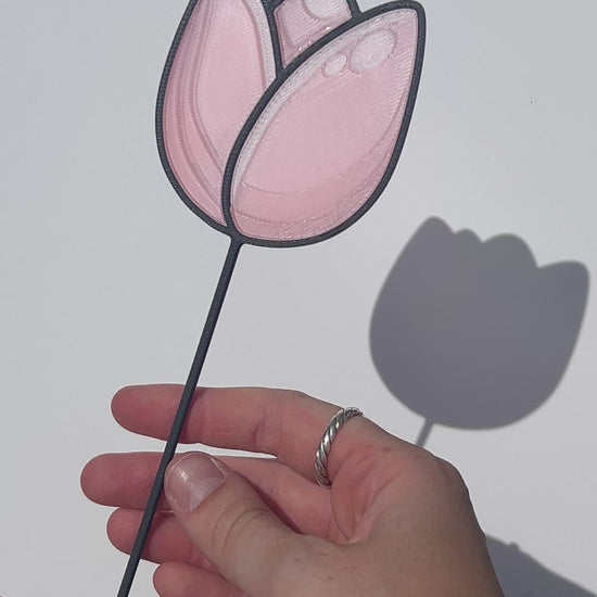 Pink translucent PLA tulip decorative stem with a black stained-glass-inspired outline.